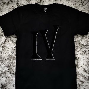 Black cotton Tee with suede signature “IV” logo with rhinestone outline.